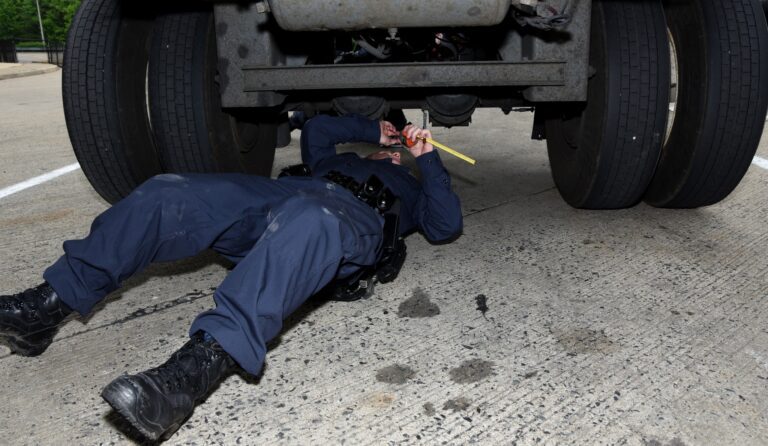 Mechanic working on a vehicle's brakes.